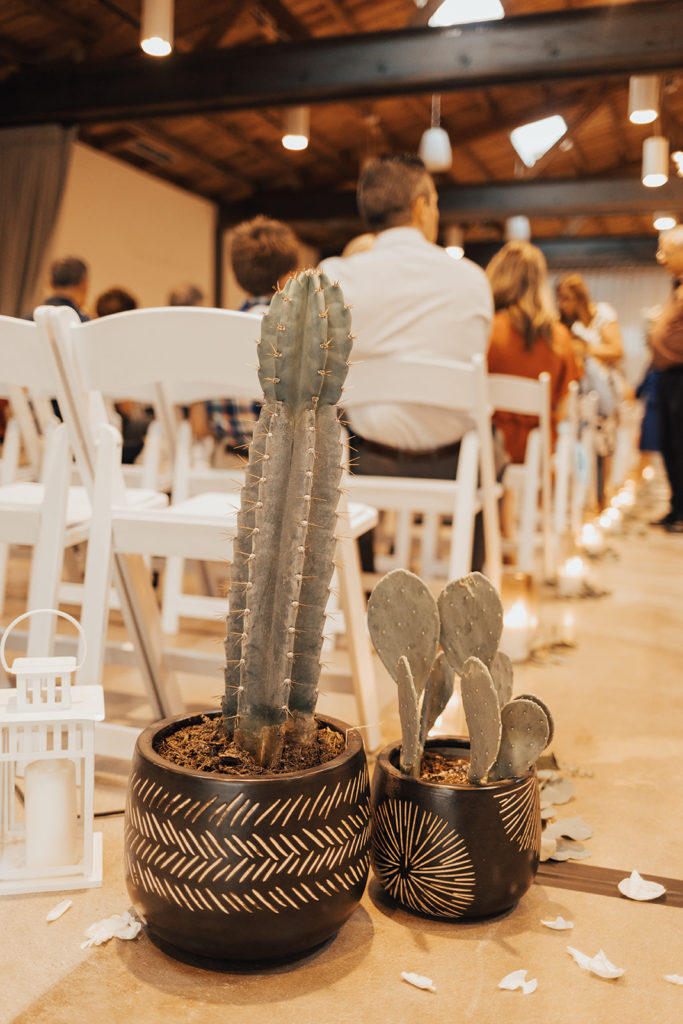 Aisle decor at Clayton House wedding in Scottsdale, Arizona. Cacti elements paired with a neutral palette.