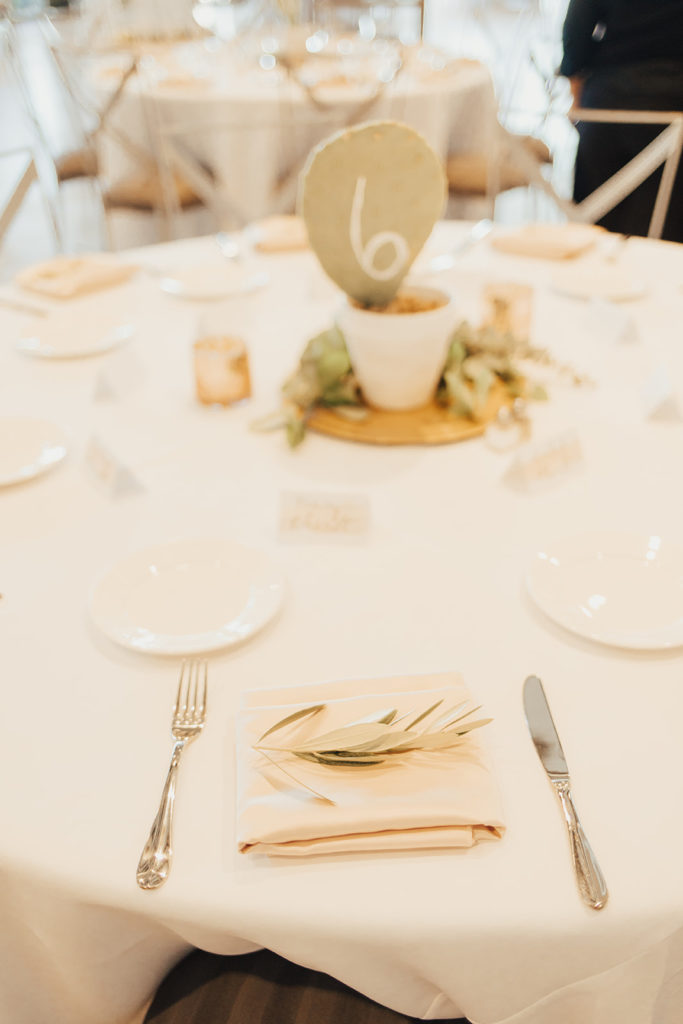 Place setting at Clayton House wedding in Scottsdale, Arizona. Cacti elements paired with a neutral palette.