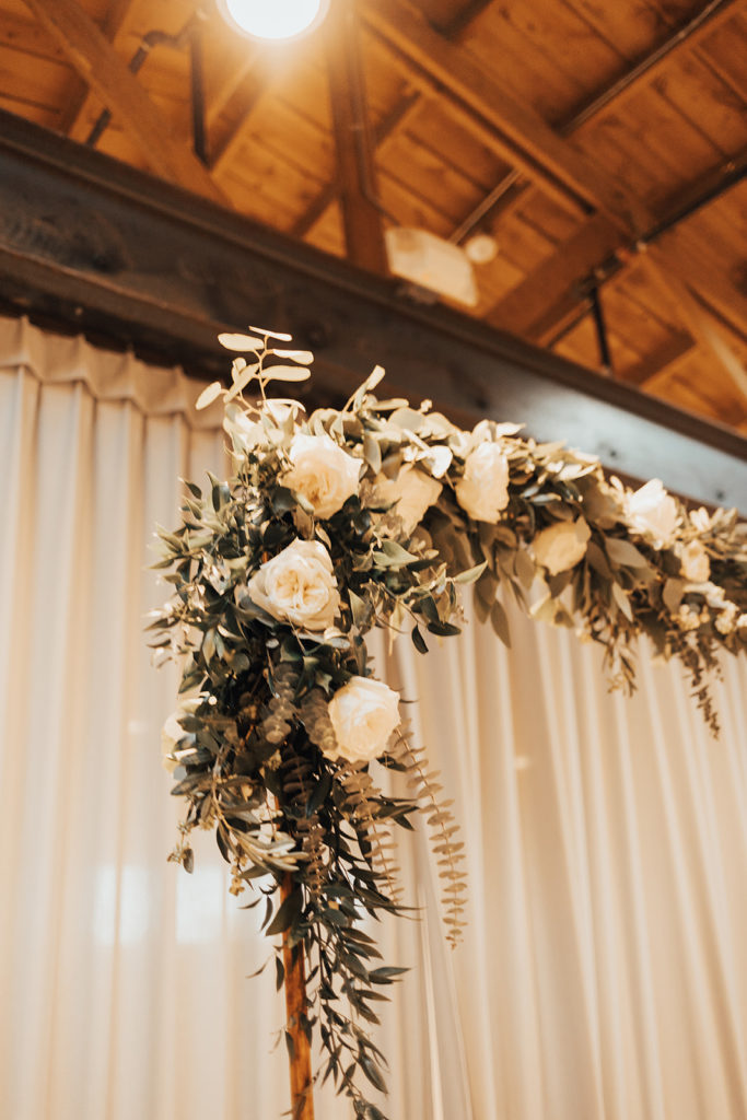 Arch floral at Clayton House wedding in Scottsdale, Arizona. Cacti elements paired with a neutral palette.