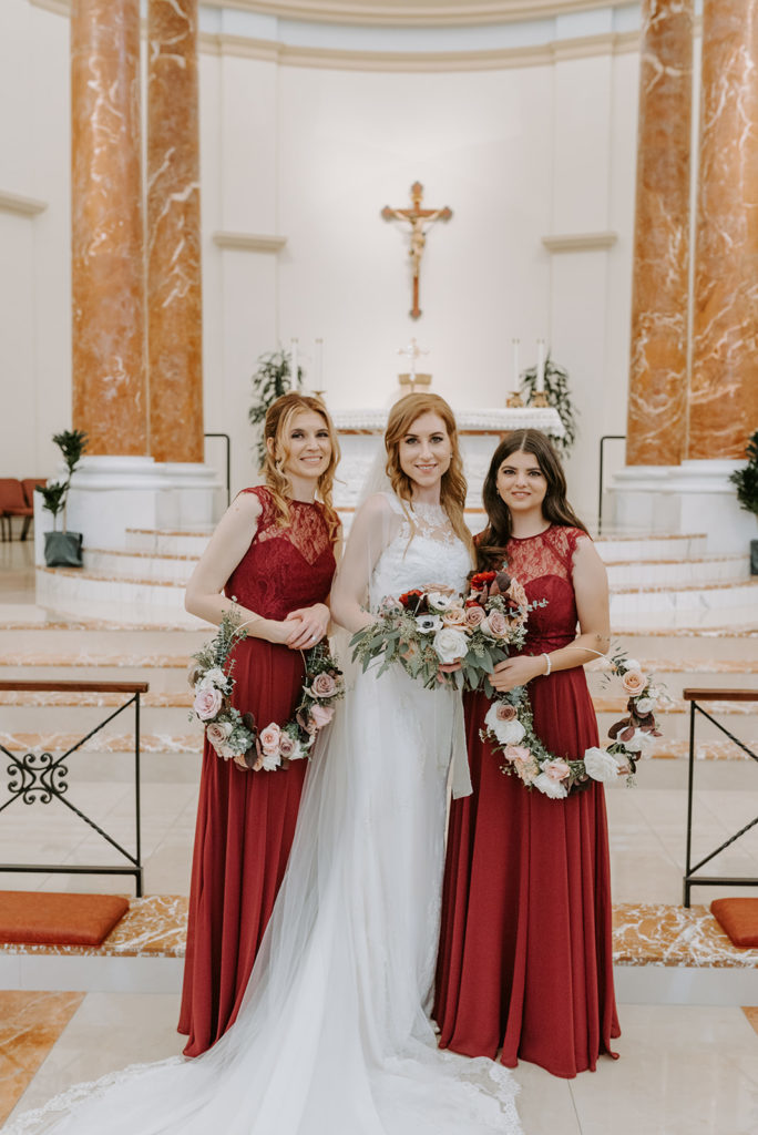 Intimate North Central Phoenix wedding of a beautiful church ceremony followed by a reception at The Orchard. Floral of red, blush, and greenery by Array Design, Phoenix, Arizona. Photographer: Nhiya Kaye Photo