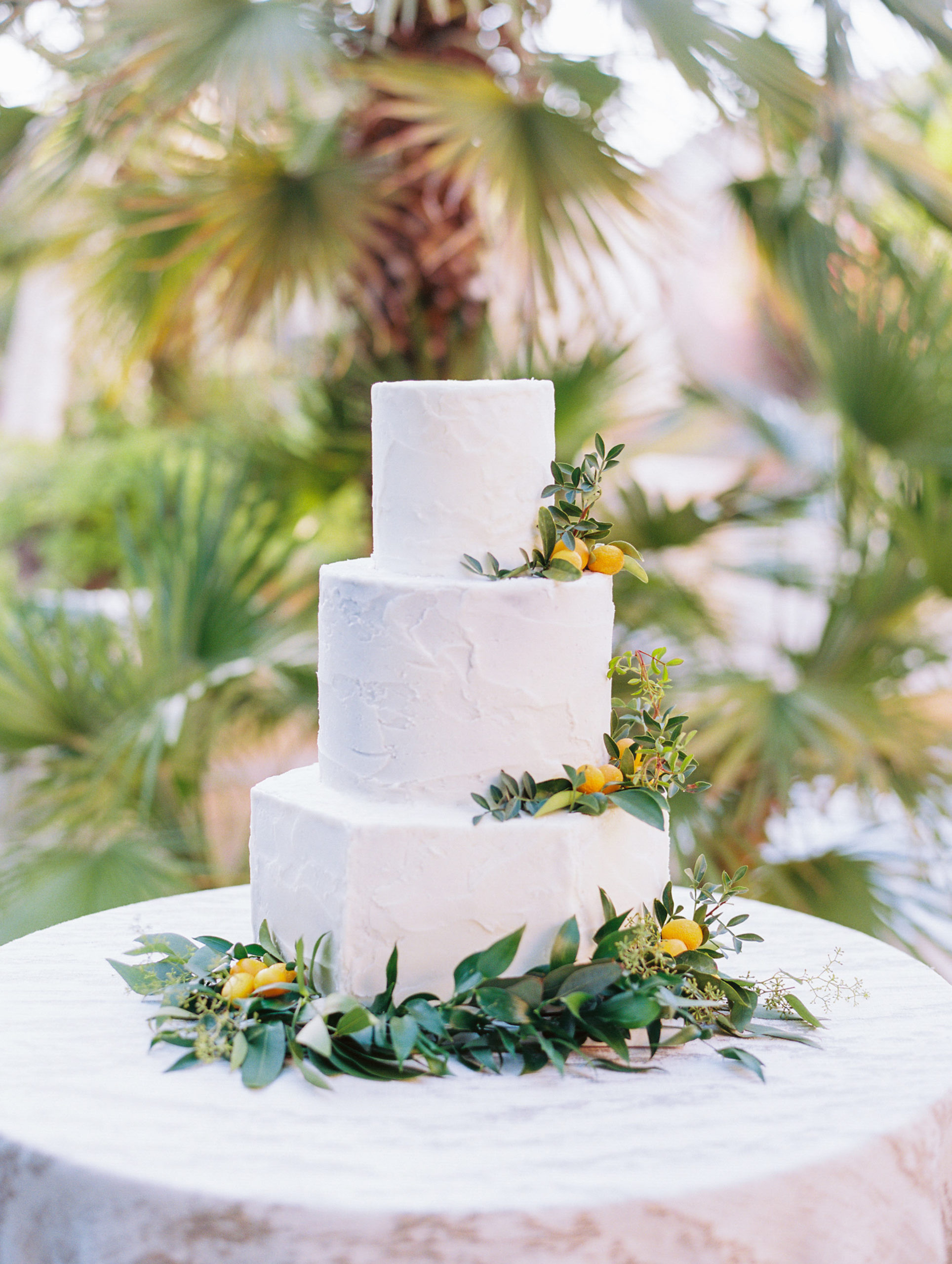White geometric wedding cake by Phoenix area baker, Dessert First by Veronica. Floral by Array Design. Photography by Tasha Brady..
