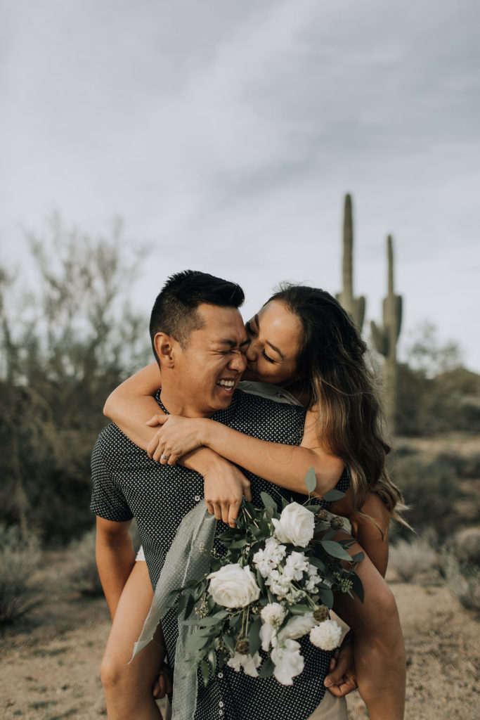 Desert engagement shoot by Alexandra Loraine Photography. White floral and greenery bouquet by Array Design, Phoenix, Arizona.