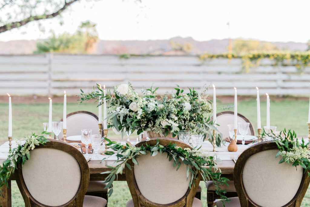 Garden style wedding greenery centerpiece with floral and greenery chair accents by Array Design, Phoenix, Arizona. Photographer: Saje