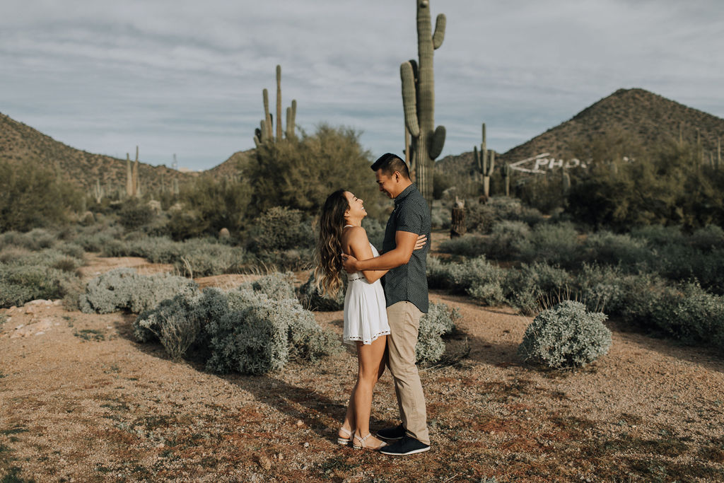 Desert engagement shoot by Alexandra Loraine Photography. White floral and greenery bouquet by Array Design, Phoenix, Arizona.