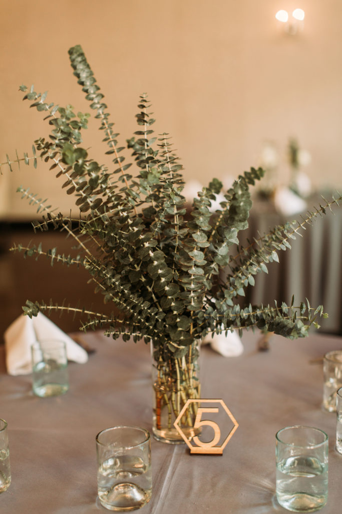 Garden style spiral eucalyptus wedding centerpiece by Array Design, Phoenix, Arizona. Photographer: Carmela Joy