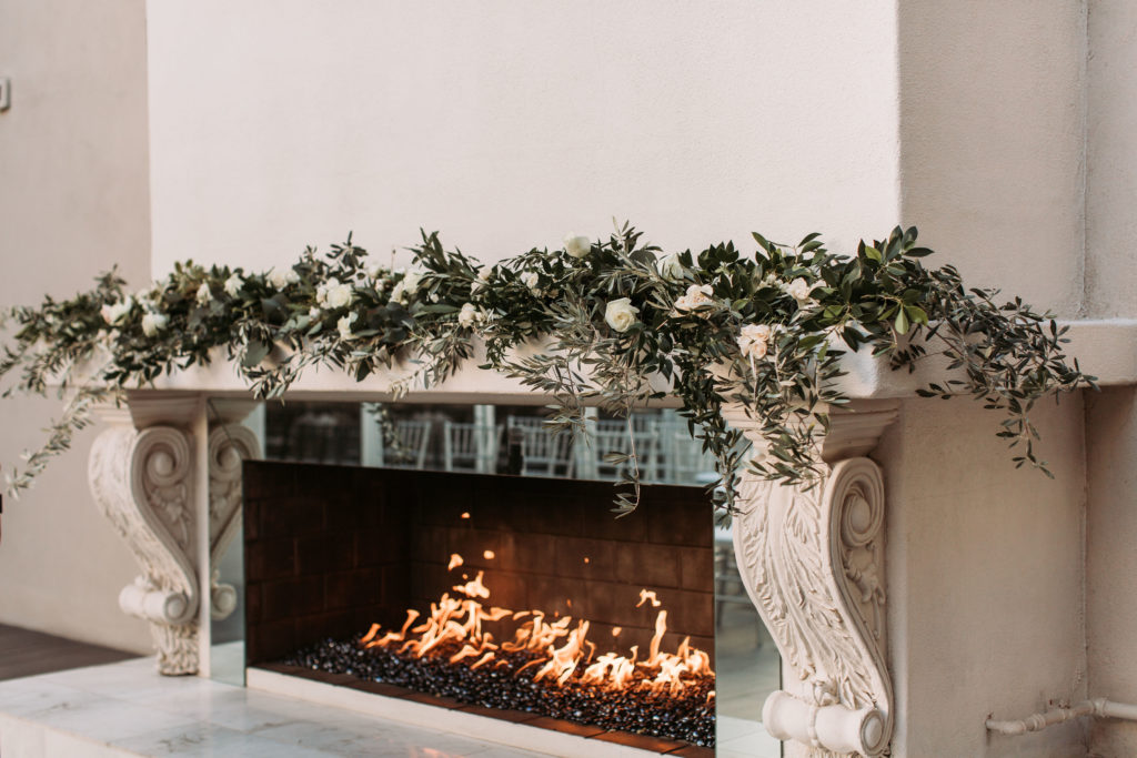 Garden style greenery wedding fireplace arrangement by Array Design, Phoenix, Arizona. Photographer: Carmela Joy