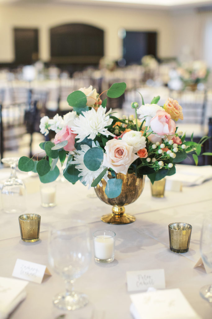 Reception centerpiece at Arizona spring wedding featuring whimsical soft palette florals and greenery by Array Design, Phoenix, Arizona. Val Vista Lakes venue and Melissa Jill photography.
