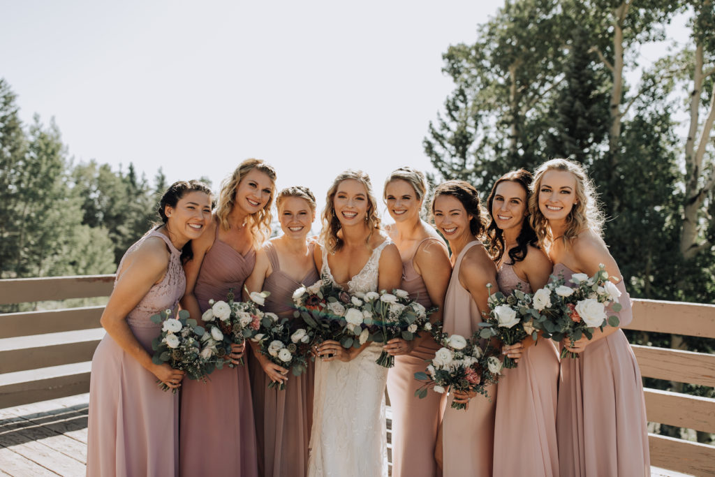 Flagstaff Mountain Wedding - fall outdoor Arizona wedding with wedding flowers in white, mauve and pink with greenery. Photos by Alexandra Loraine.