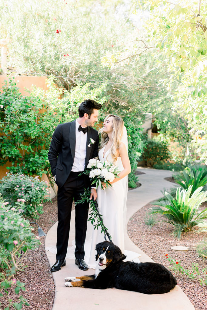 Dog leash greenery at Arizona wedding Phoenix venue, Royal Palms. Stylish celebration featuring white wedding flowers and greenery with pillar candles featured in reception and ceremony. Floral arrangements by Array Design. Photography by Jessica Q.