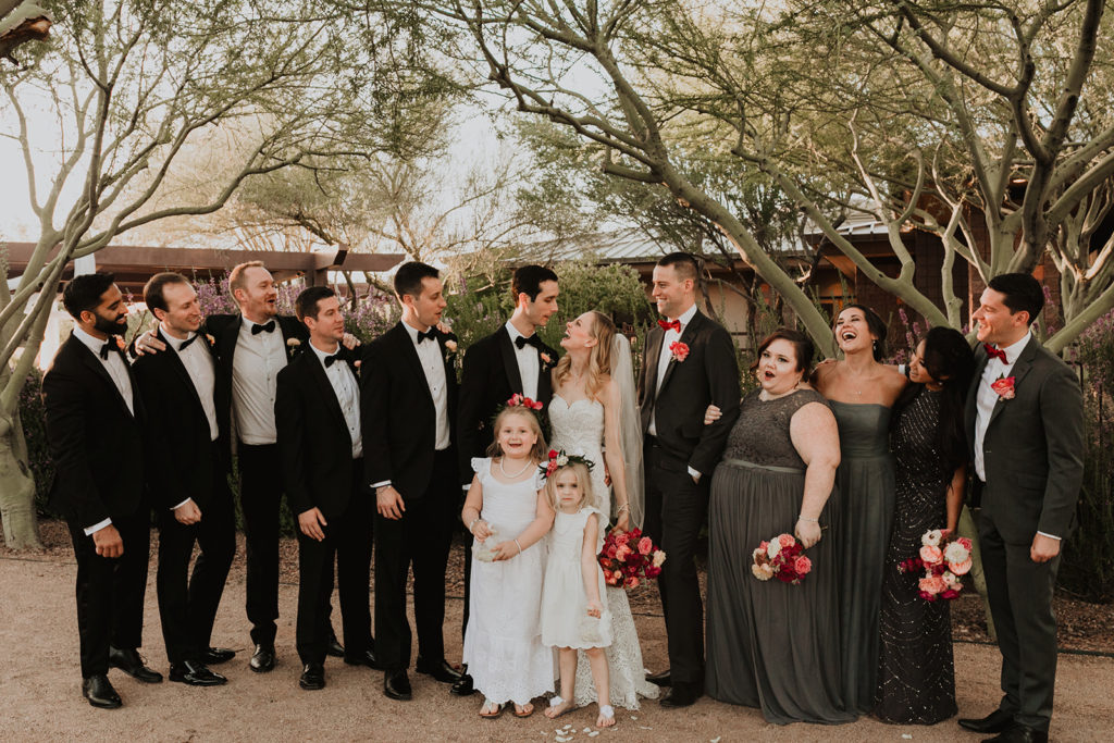 Wedding party at bougainvillea inspired Arizona wedding with bright floral arrangements and mountain views at this desert wedding. Wedding flowers by Array Design, Phoenix, Arizona. Photographer Kristen Hennke.