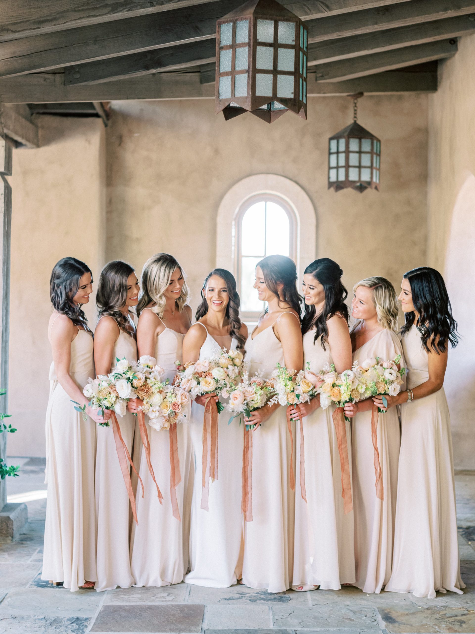 Bridesmaids and bride holding bouquets.