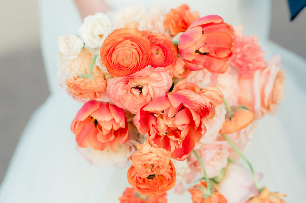 Bright, peach colored bridal bouquet.