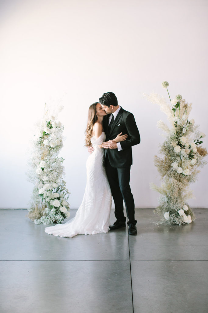 bride-groom-wedding-ceremony-floral-pillars