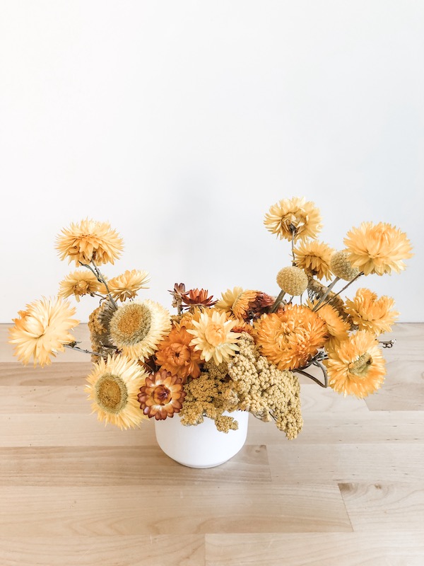 Yellow dried flowers floral arrangement.