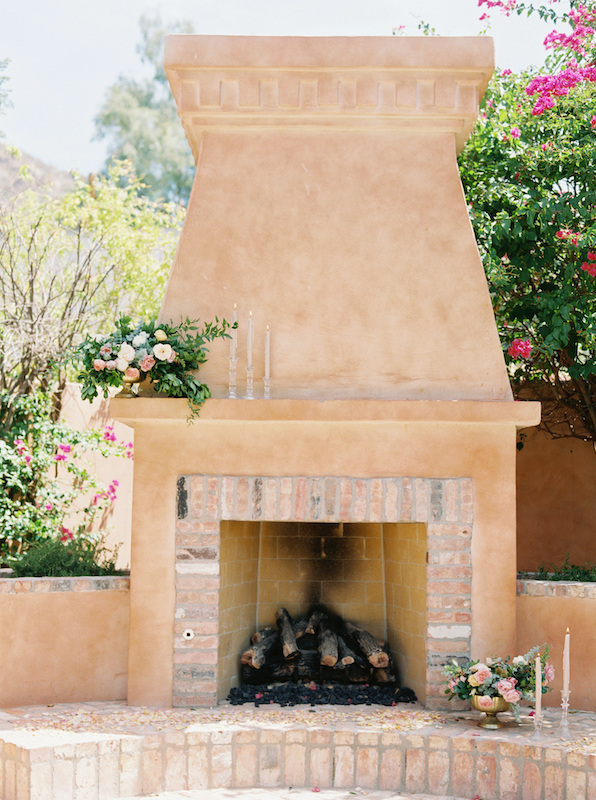 Royal Palms outdoor fireplace with brick details.