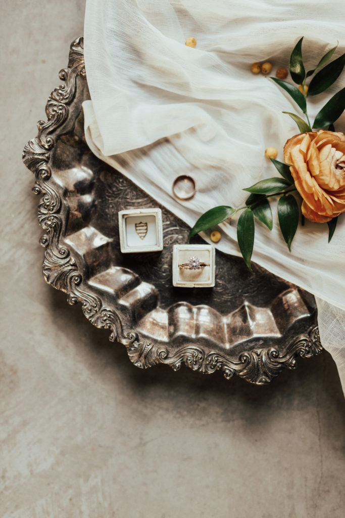 Wedding rings details on metal plate.