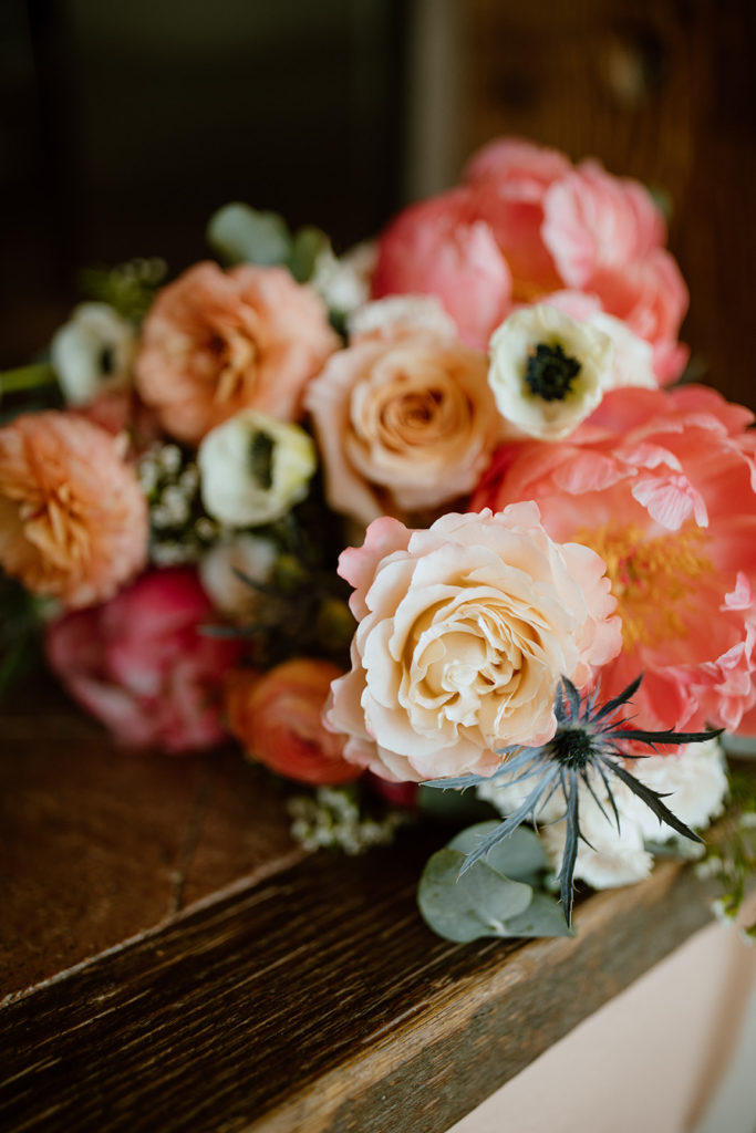 Spring pink and peach flowers bridal bouquet.