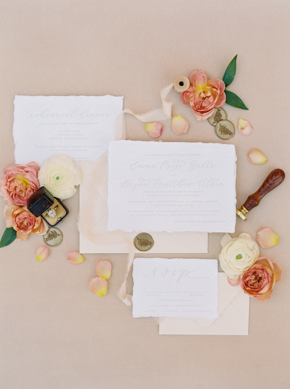 Wedding invitation suite with flower details.