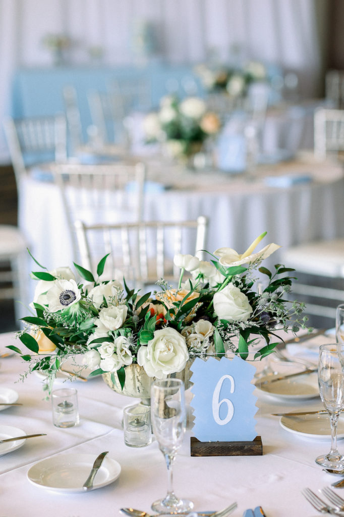 Wedding reception centerpieces and table numbers.