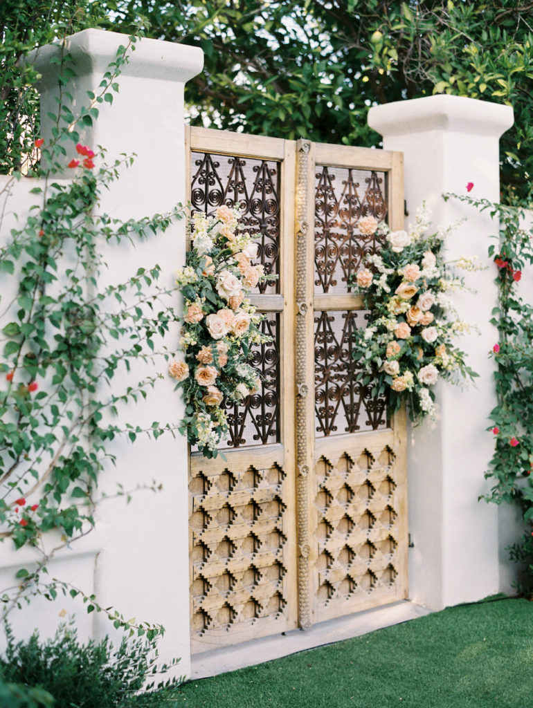 El Chorro wedding ceremony door background floral.
