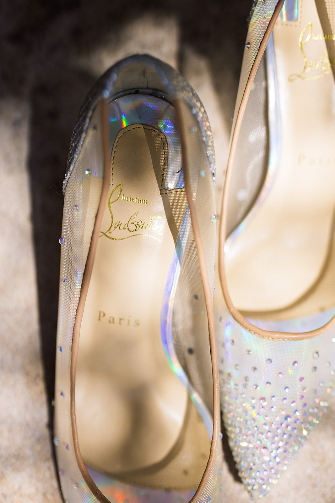 Detail photograph of bride's sheer heels with sequins.
