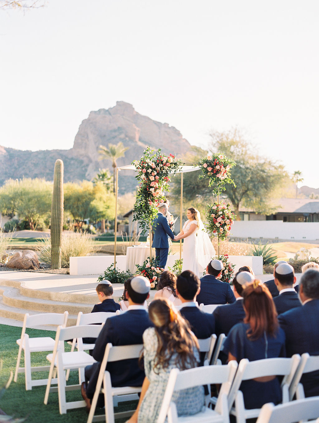 Bride and groom during outdoor wedding ceremony at Mountain Shadows in Arizona.