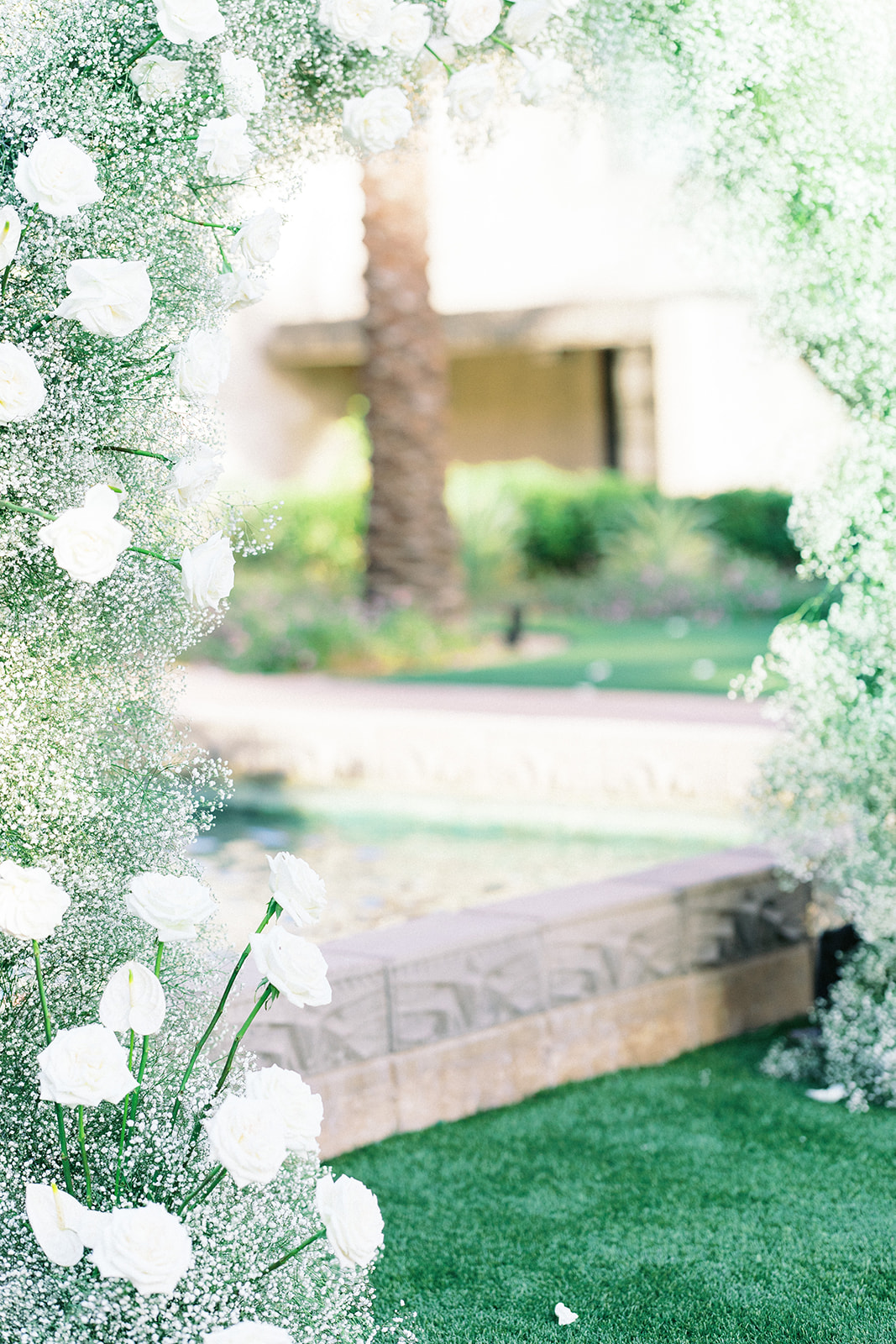 Detail photograph of baby's breath wedding ceremony arch.