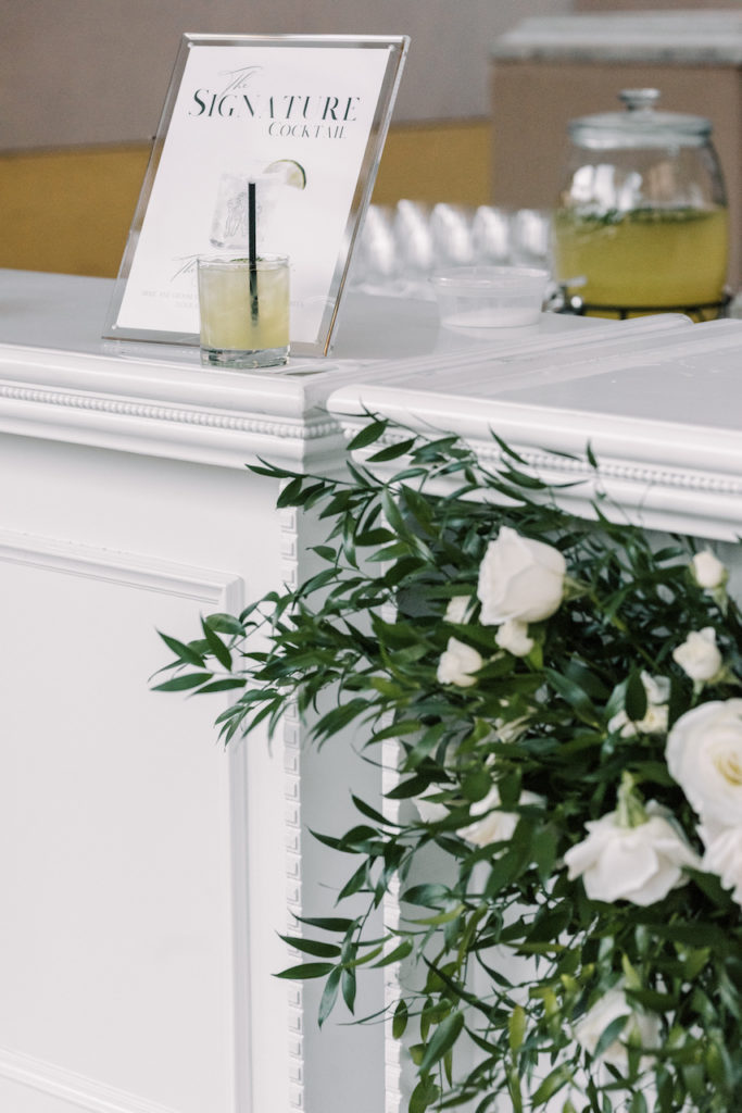 Greenery on wedding cocktail bar.