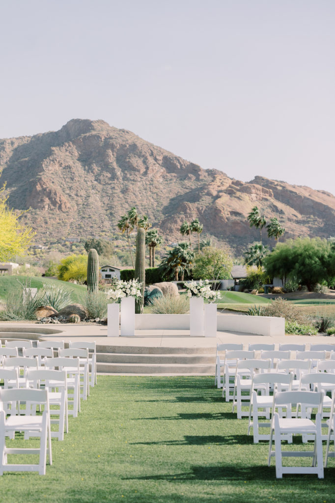 Mountain Shadows outdoor wedding ceremony on lawn.