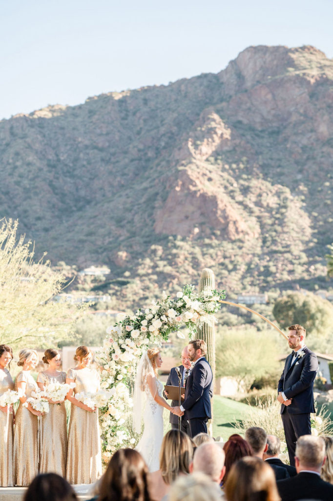 Outdoor wedding ceremony at Mountain Shadows with mountain backdrop.