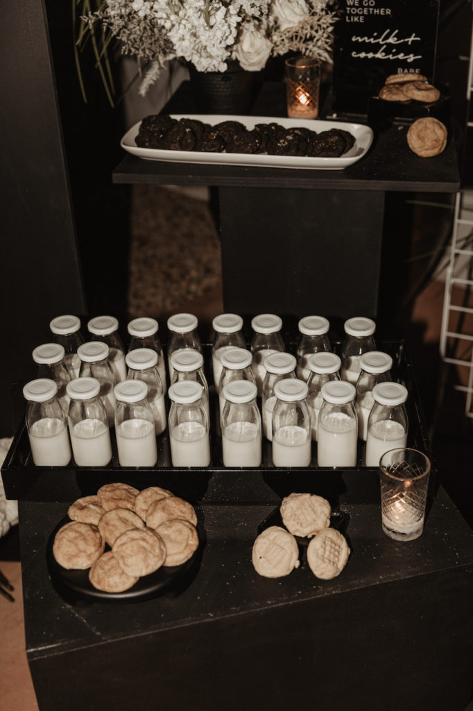 Individual bottled milk with cookies for wedding ceremony dessert.