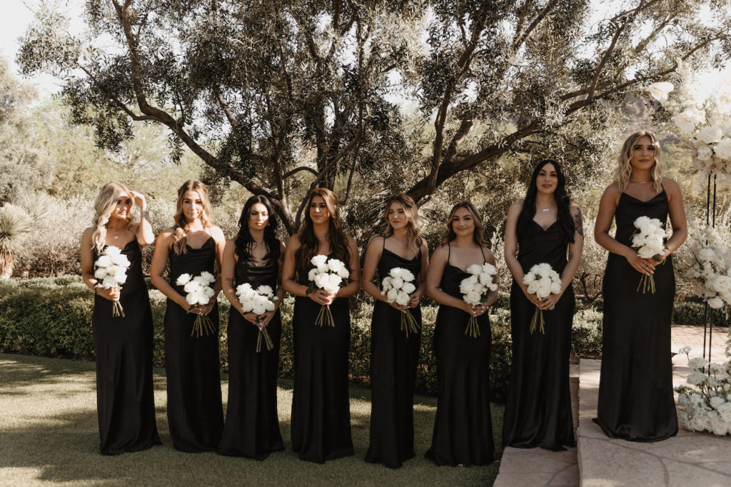 Bridesmaids lined up to side at outdoor El Chorro wedding ceremony.