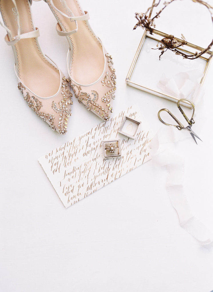 Sheer bridal shoes and natural hair piece with wedding ring and details.