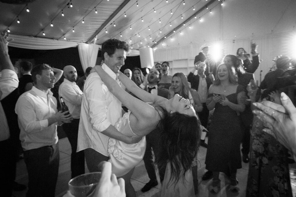 Bride and groom dancing at wedding reception.