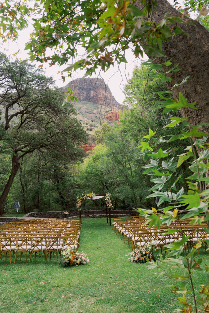 Sedona wedding ceremony outside with mountain views in backdrop and guest chairs set up in front of altar.