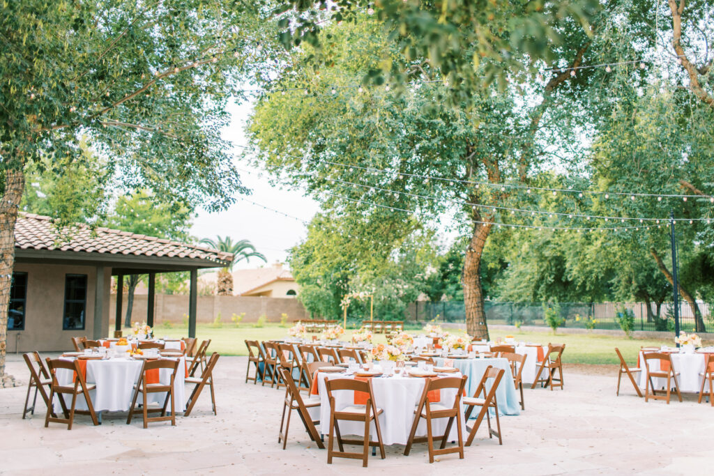 The Caroline venue outdoor reception set up with round tables.