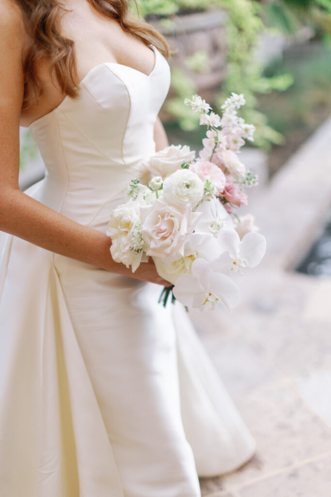 Bridal bouquet of white and soft pink flowers.