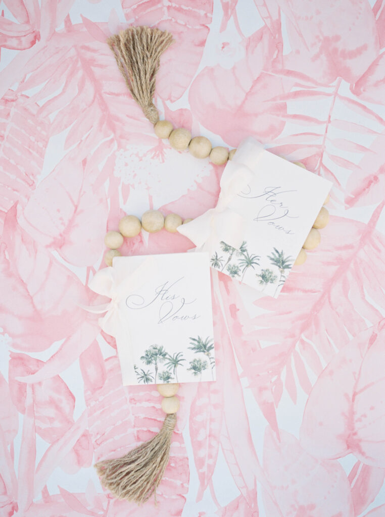 Bride and groom vow books with tassels.