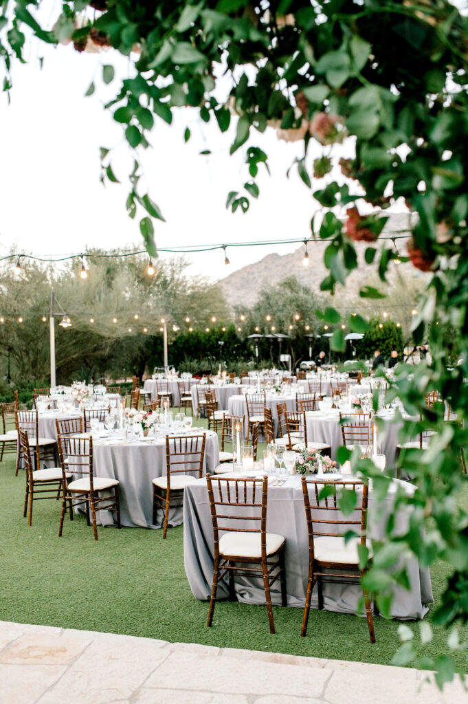 Outdoor wedding reception at El Chorro venue with round tables.