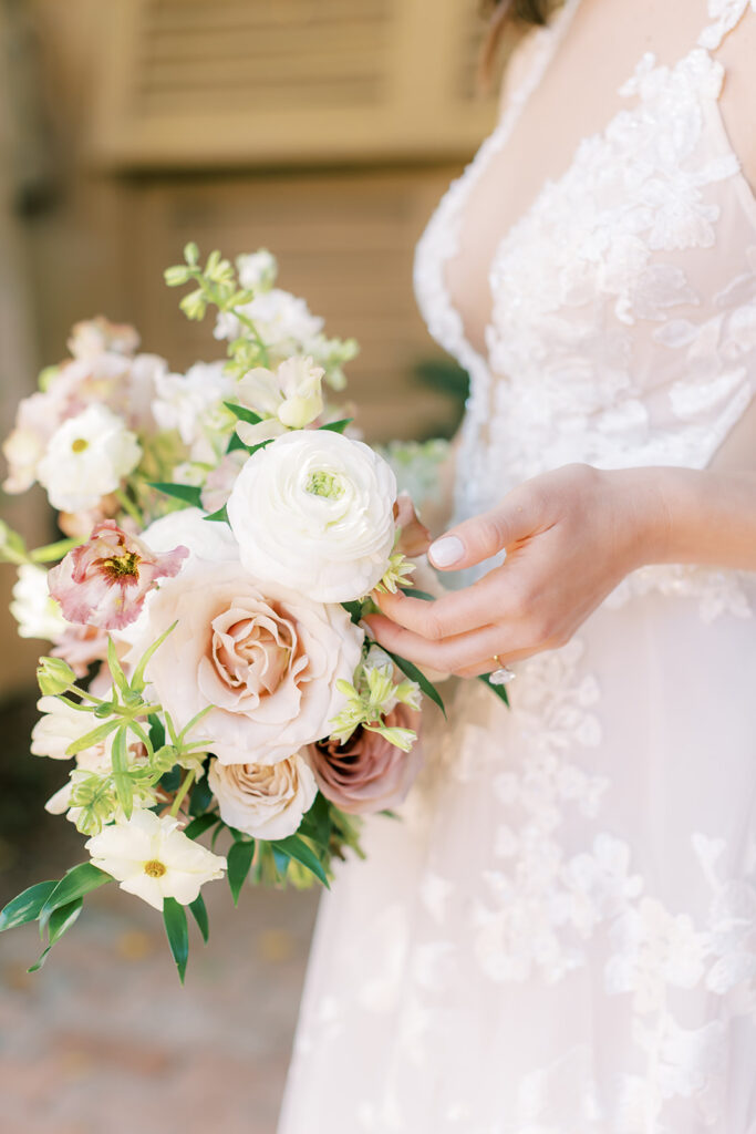 Bridal bouquet of white and blush flowers.