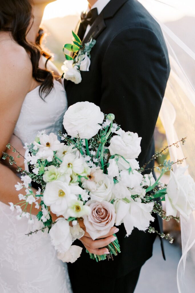 Dainty white flowers bridal bouquet with hint of blush.