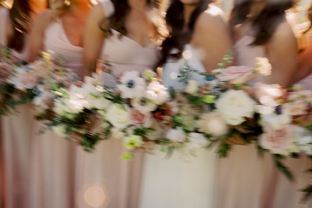 Motion image of bridesmaids and brides holding bouquets.