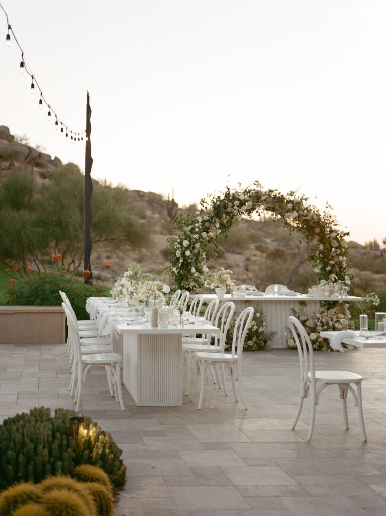 Outdoor reception space at Estancia with long reception tables and sweetheart table.
