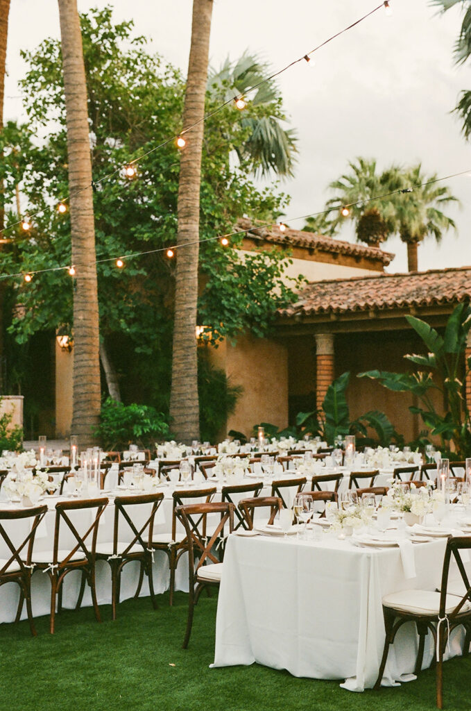 Outdoor wedding reception at Royal Palms with long rectangle tables.