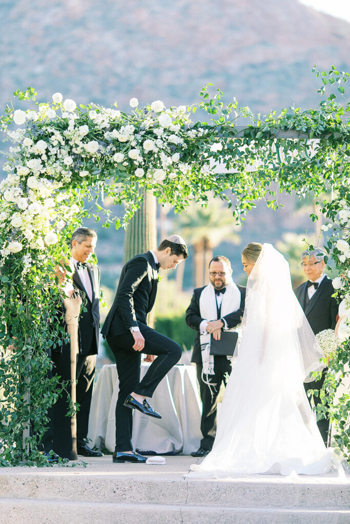 Outdoor wedding, groom stepping on glass ceremony.