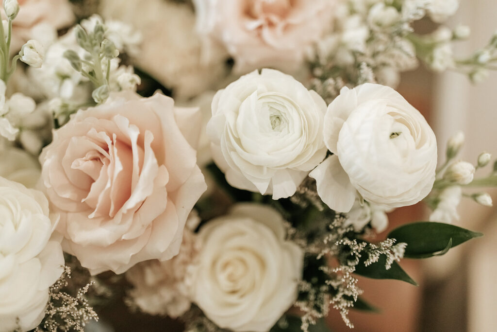 Detail image of white and blush flowers for wedding flower arrangements.