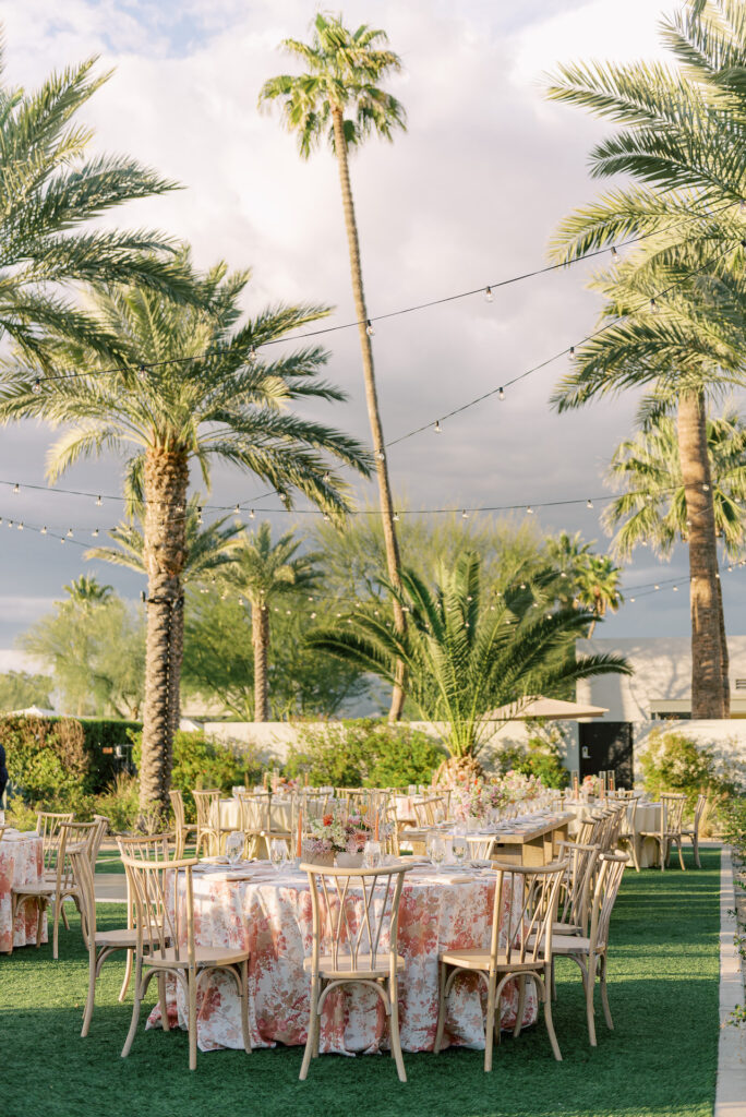 Outdoor wedding reception at Andaz Resort with round tables.