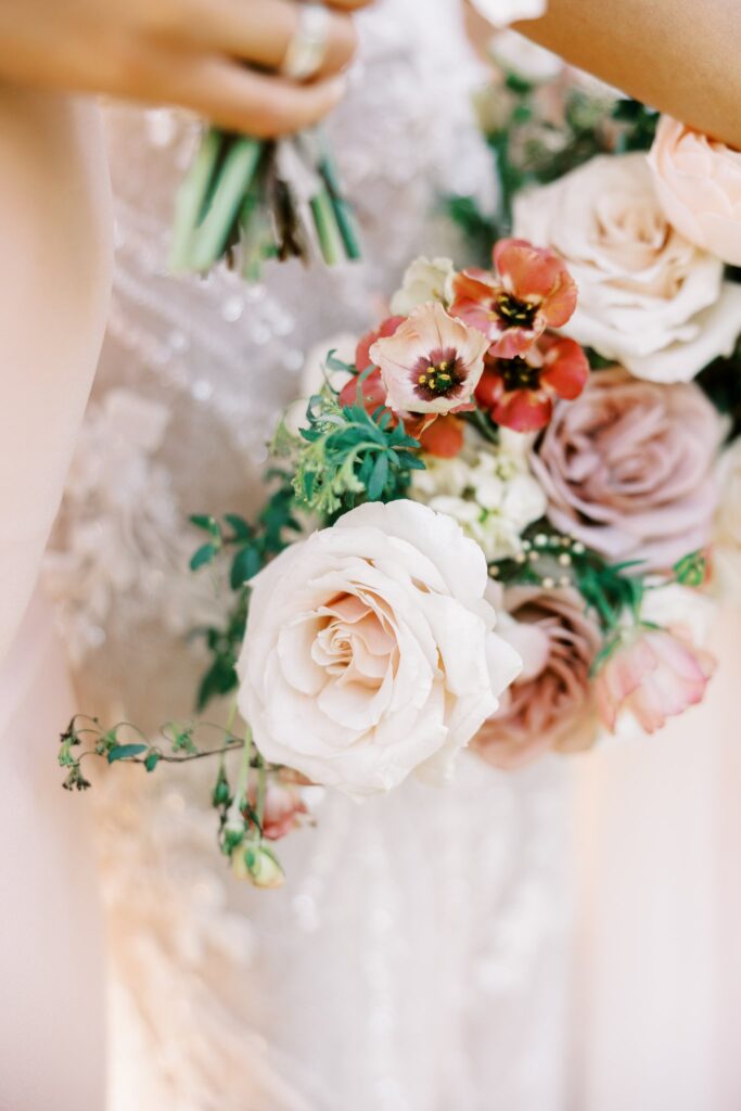 Wedding flowers of white, pink, and mauve colors.