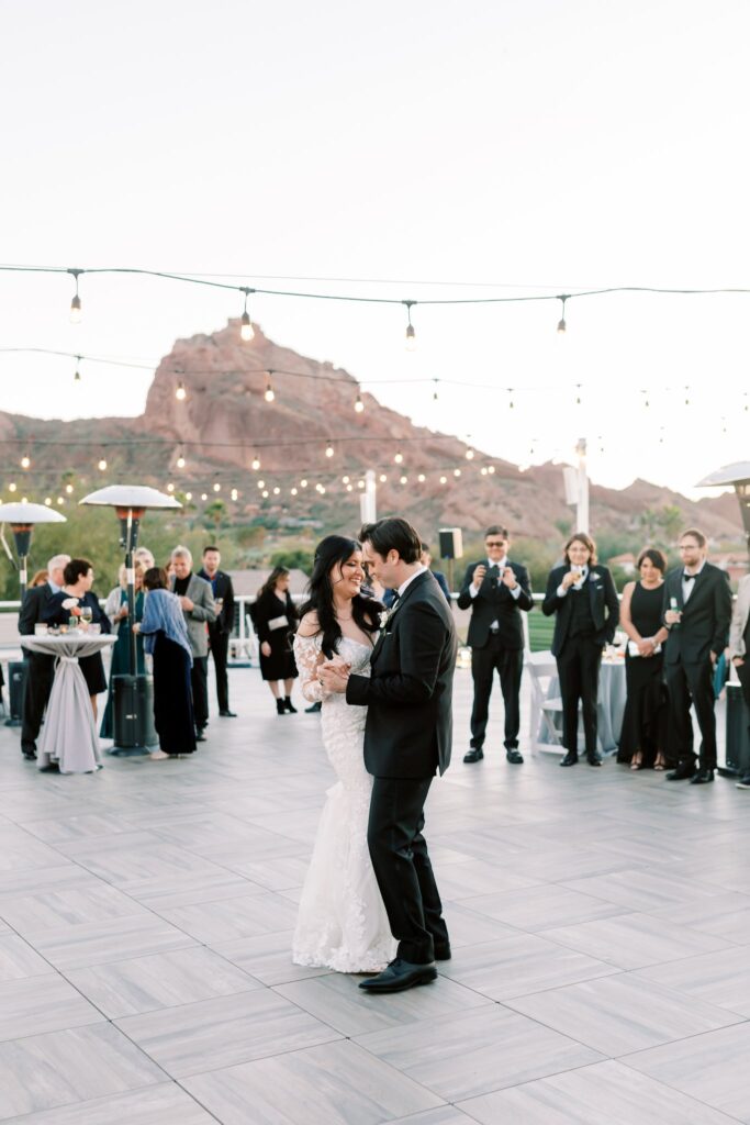 Bride and groom dancing at outdoor wedding ceremony at Mountain Shadows.