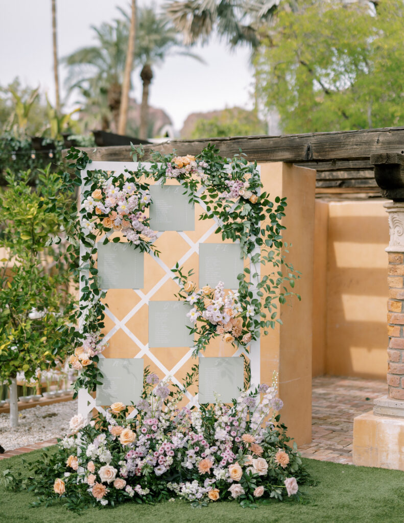 Custom lattice wedding escort board for floral installations.